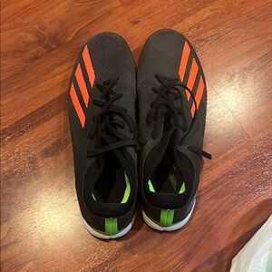Adidas Black and Orange indoor soccer shoes with Green Accent